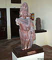 पगड़ी पहिने दण्डधारी पुरुष Holding An Ornamental